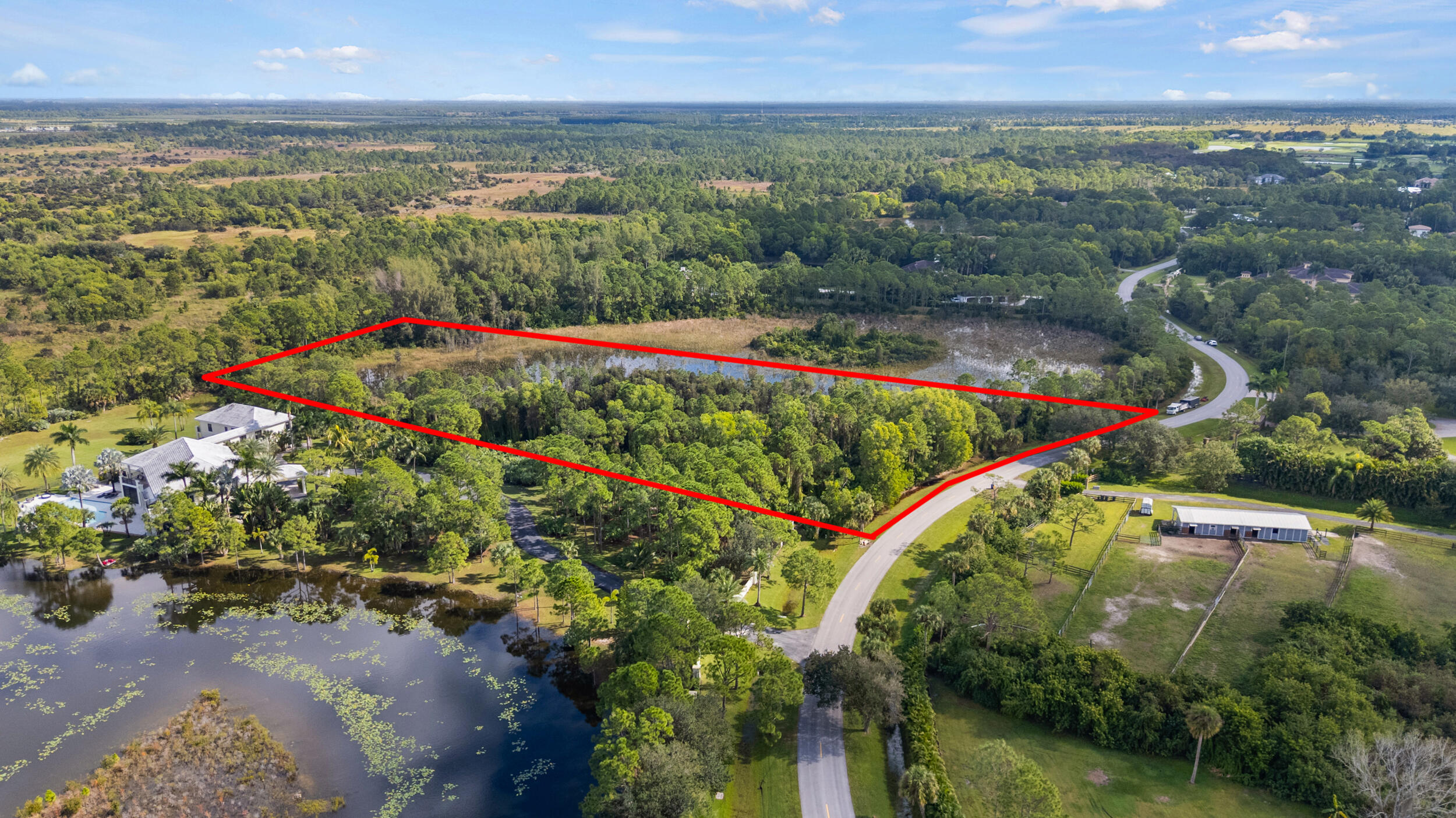 2524 Southeast Ranch Acres Circle Jupiter, FL 33478 - Photo 4 of 5 DJI_20251104231828_04172_D