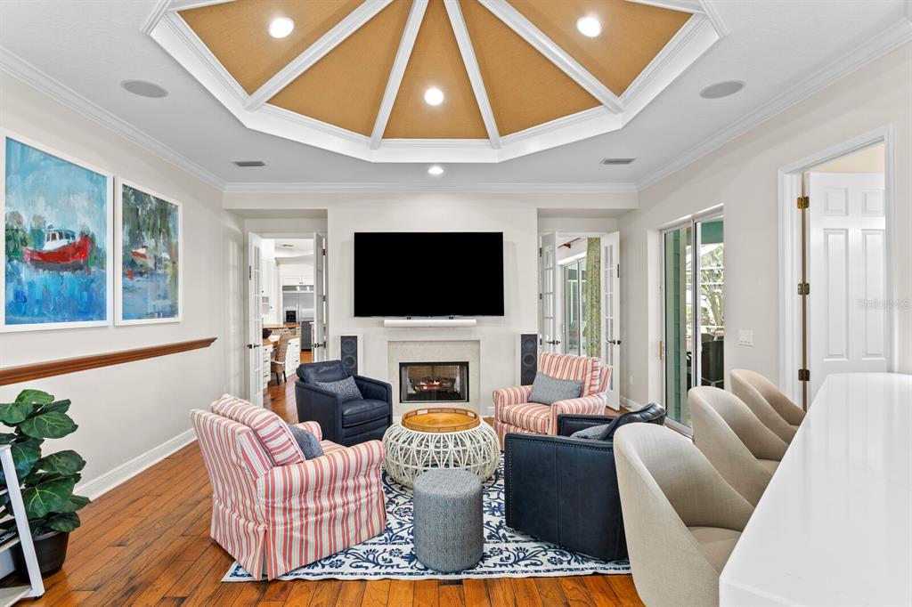 625 Balibay Road Apollo Beach, FL 33572 - Photo 16 of 51 a living room with furniture a flat screen tv and a chandelier
