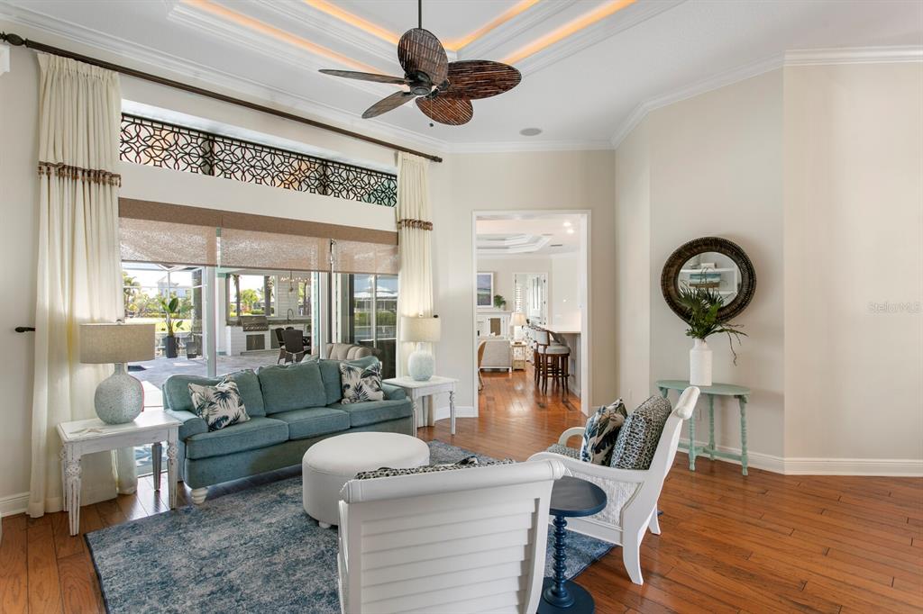 625 Balibay Road Apollo Beach, FL 33572 - Photo 20 of 51 a living room with furniture a clock on wall and a large window