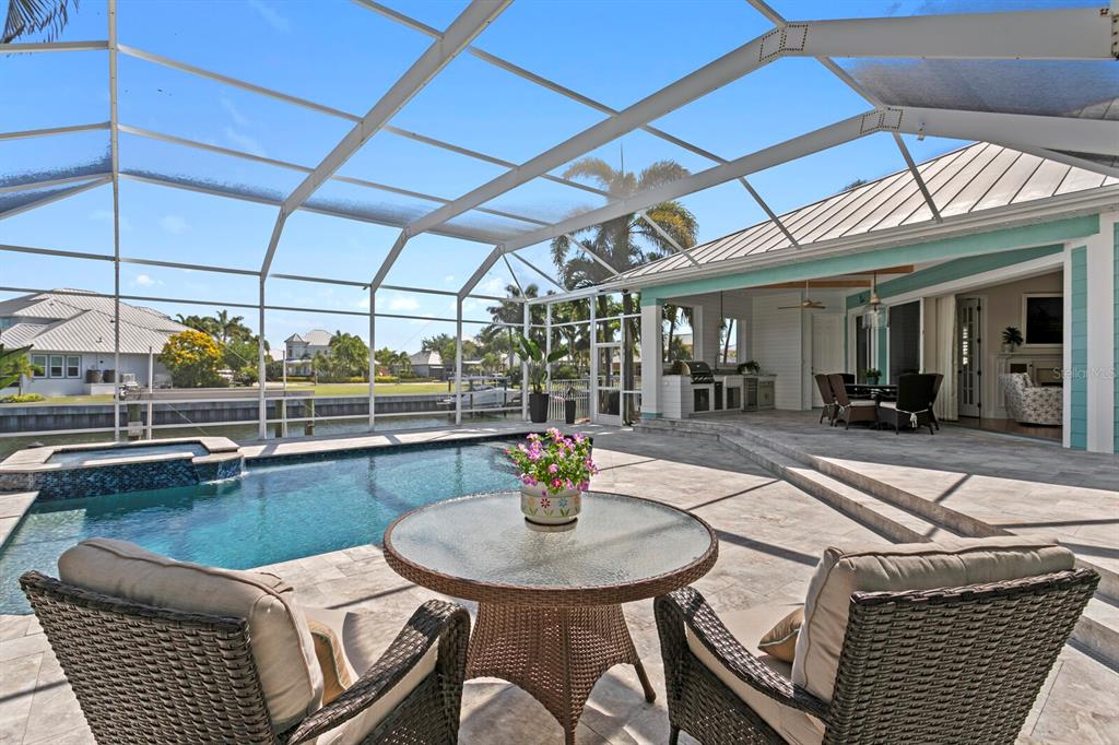 625 Balibay Road Apollo Beach, FL 33572 - Photo 2 of 51 a view of a patio with swimming pool table and chairs