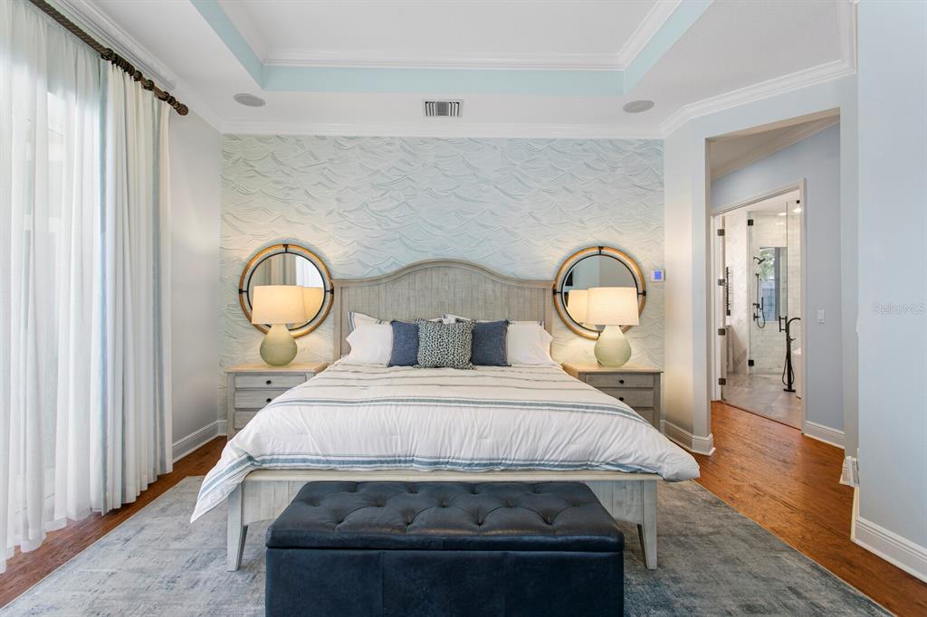 625 Balibay Road Apollo Beach, FL 33572 - Photo 22 of 51 a bedroom with a bed and wooden floor
