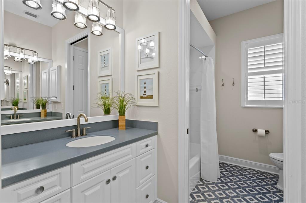 625 Balibay Road Apollo Beach, FL 33572 - Photo 28 of 51 a bathroom with a sink a light fixture and a mirror