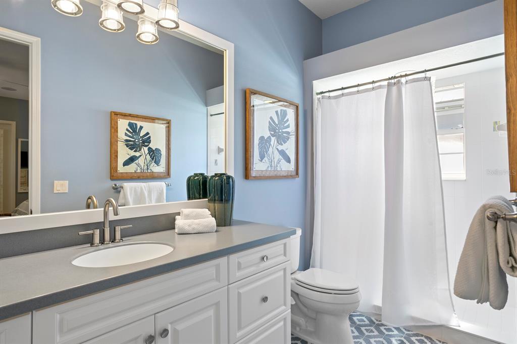 625 Balibay Road Apollo Beach, FL 33572 - Photo 31 of 51 a bathroom with a granite countertop sink toilet and a mirror