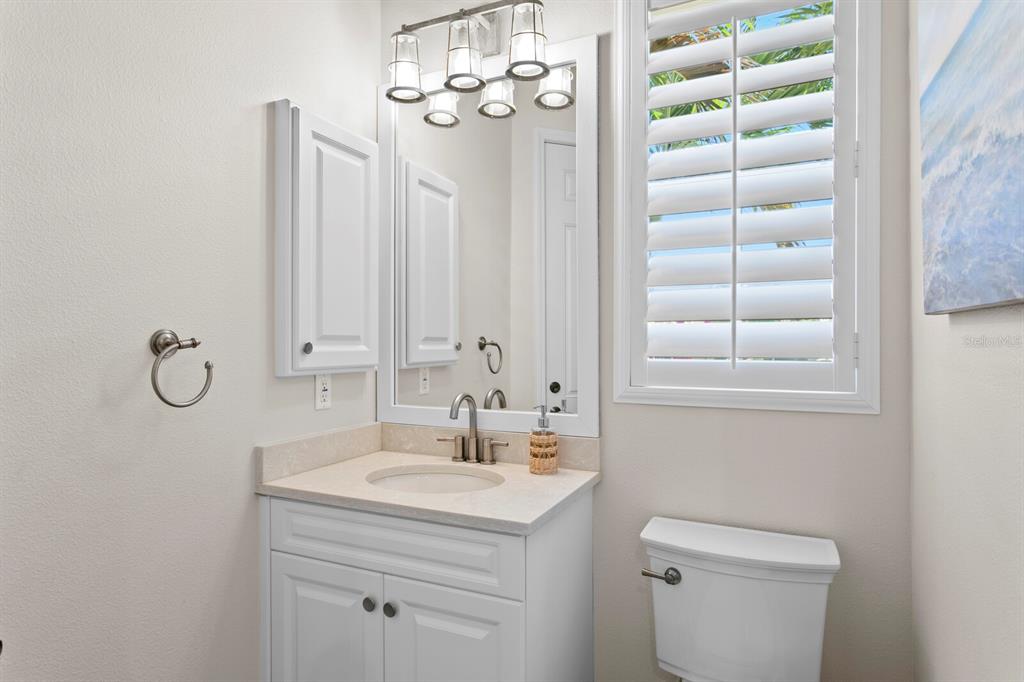 625 Balibay Road Apollo Beach, FL 33572 - Photo 42 of 51 a bathroom with a sink a toilet and a mirror