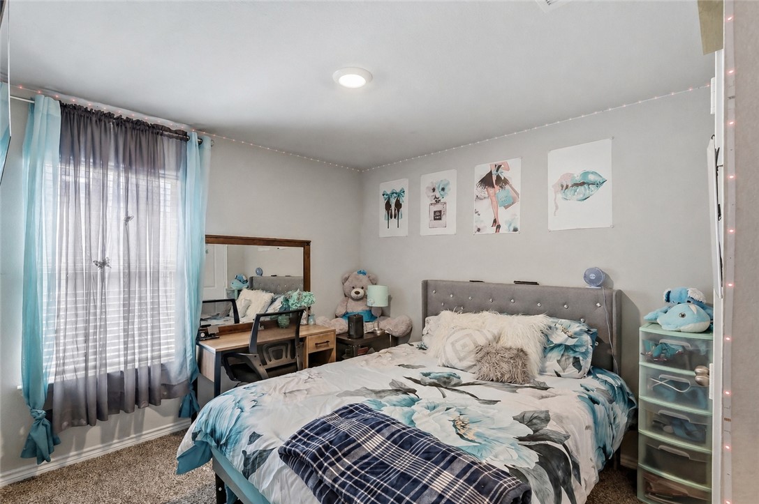 2009 Chief Street Bryan, TX 77807 - Photo 21 of 27 a bedroom with a bed and a window