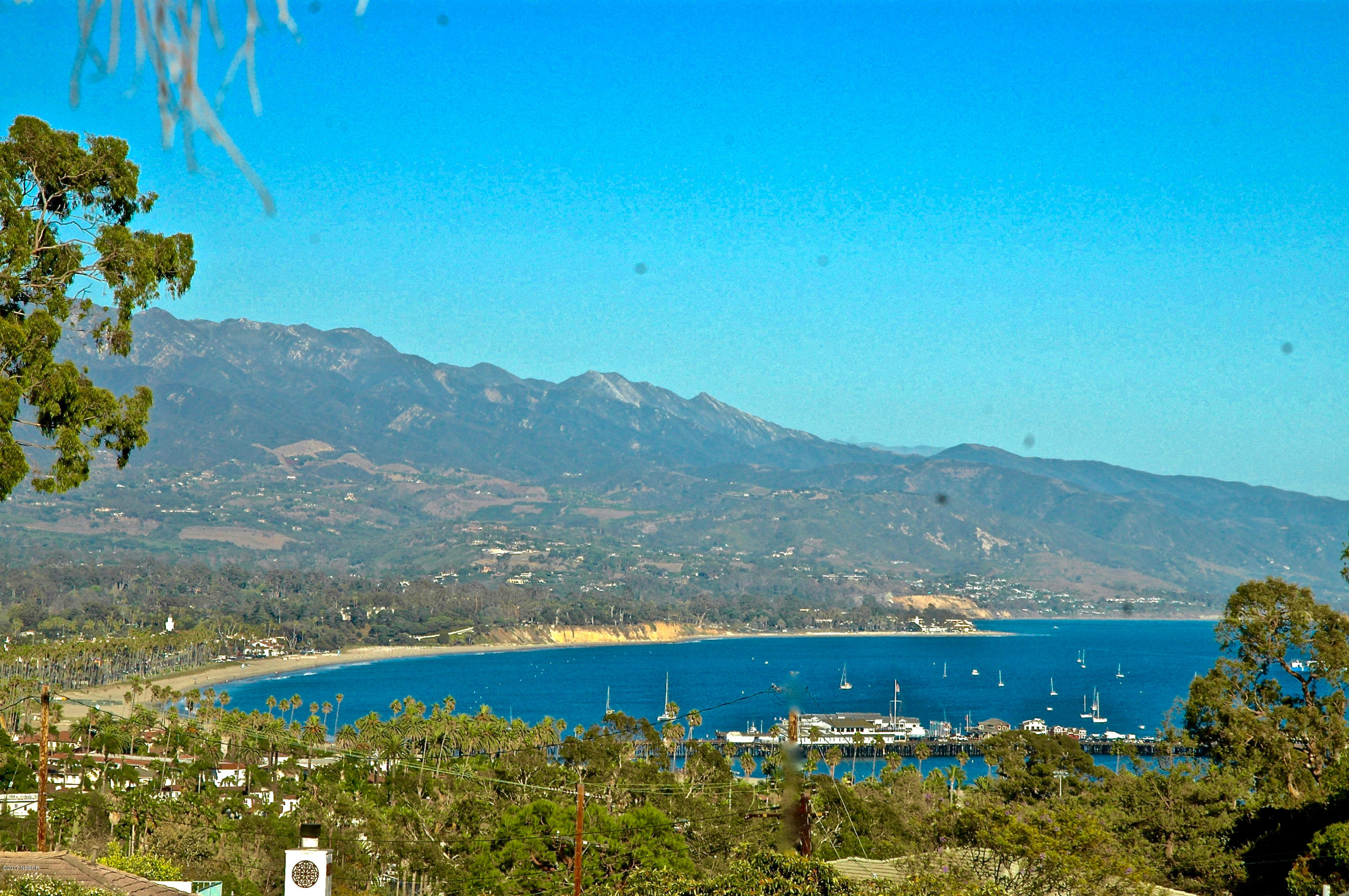 965 Isleta Avenue Santa Barbara, CA 93109 - Photo 1 of 17 a view of a yard with wooden fence and mountain view