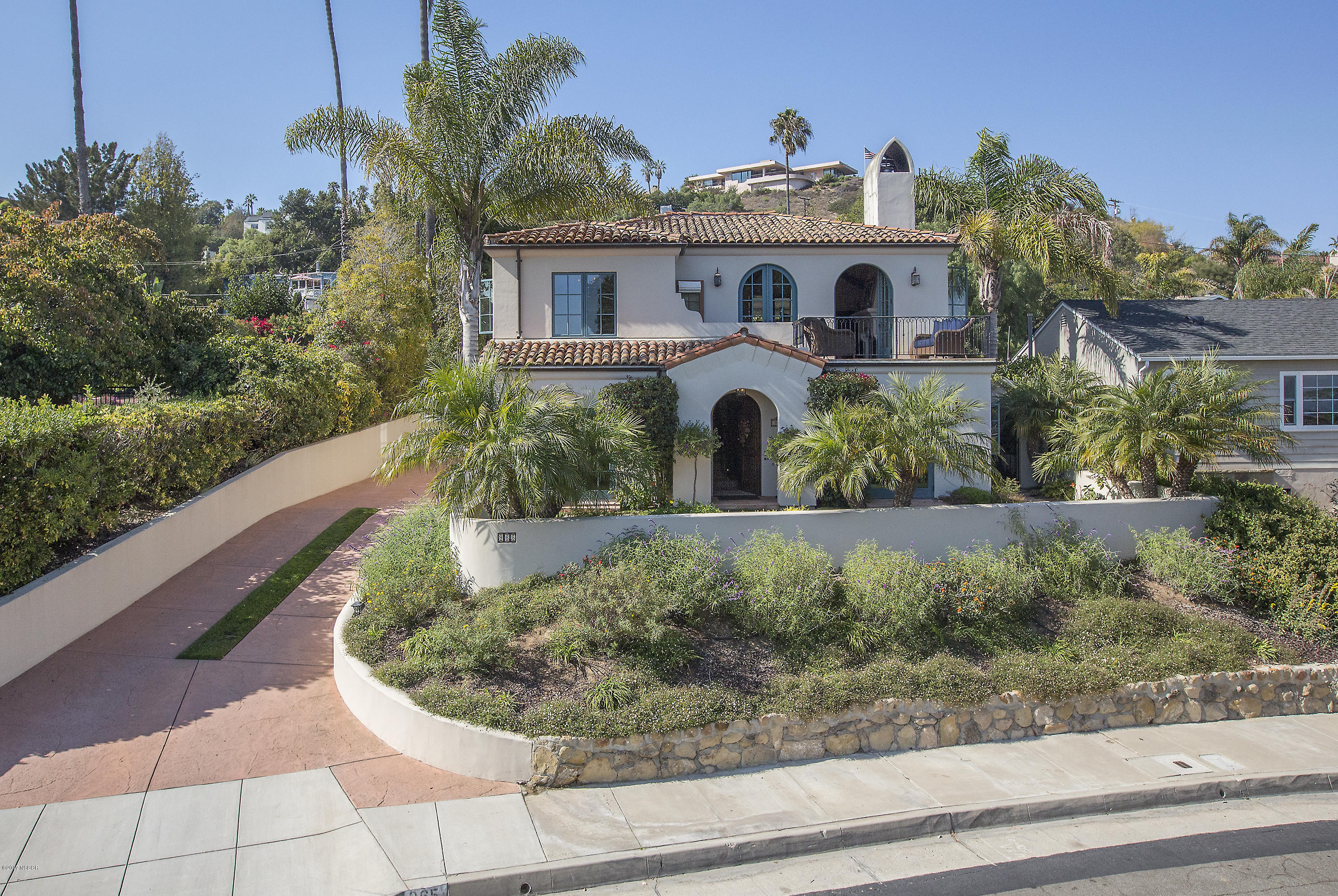 965 Isleta Avenue Santa Barbara, CA 93109 - Photo 10 of 17 a front view of a house with a yard