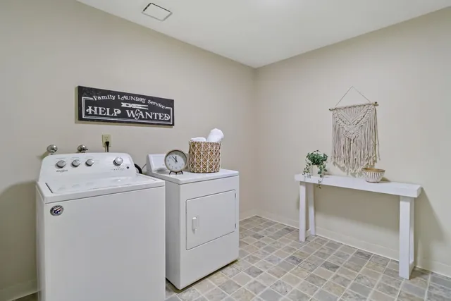 a utility room with dryer and washer