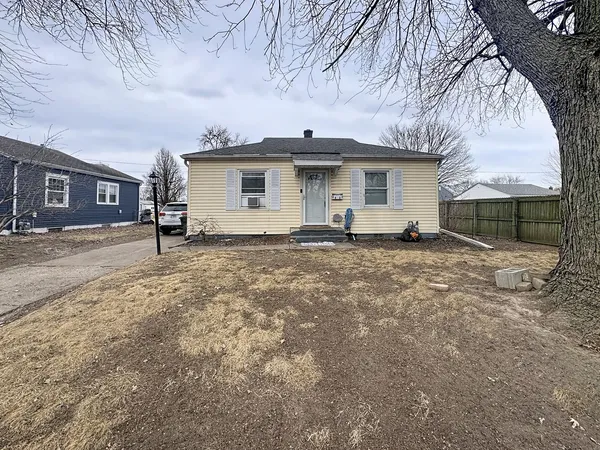 a view of a house with a snow in the yard