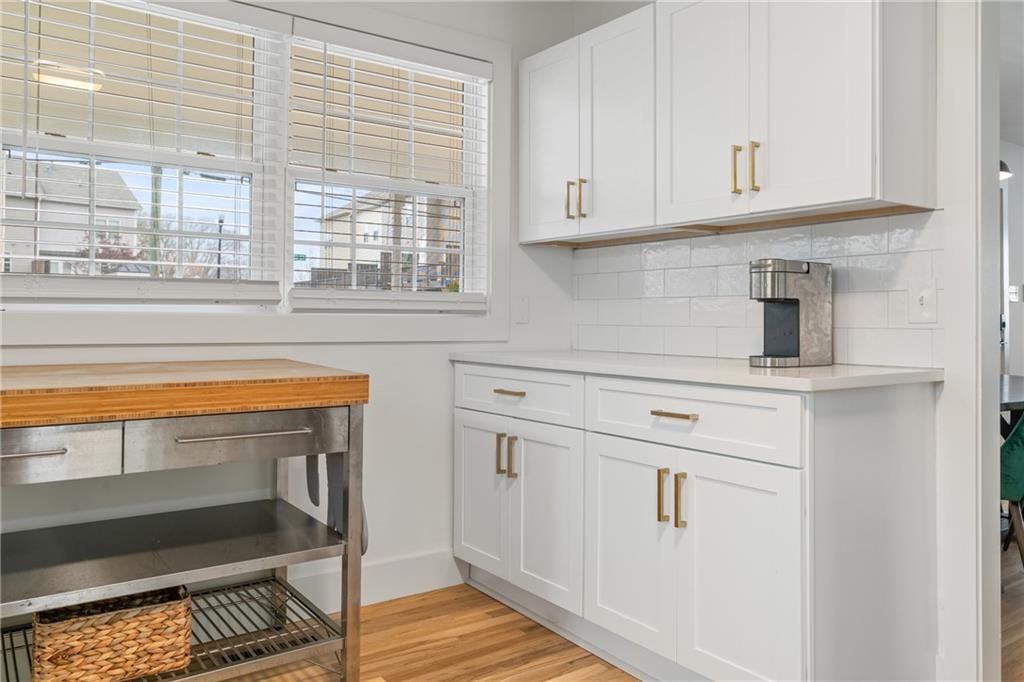 2790 Sardis Street Kennesaw, GA 30144 - Photo 22 of 49 a kitchen with white cabinets and a window