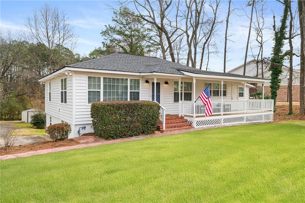 2790 Sardis Street Kennesaw, GA 30144 - Photo 3 of 49 a view of a house with a backyard and a tree