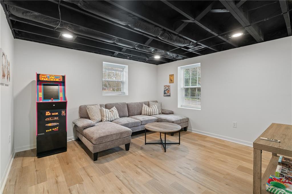 2790 Sardis Street Kennesaw, GA 30144 - Photo 32 of 49 a living room with furniture and a wooden floor