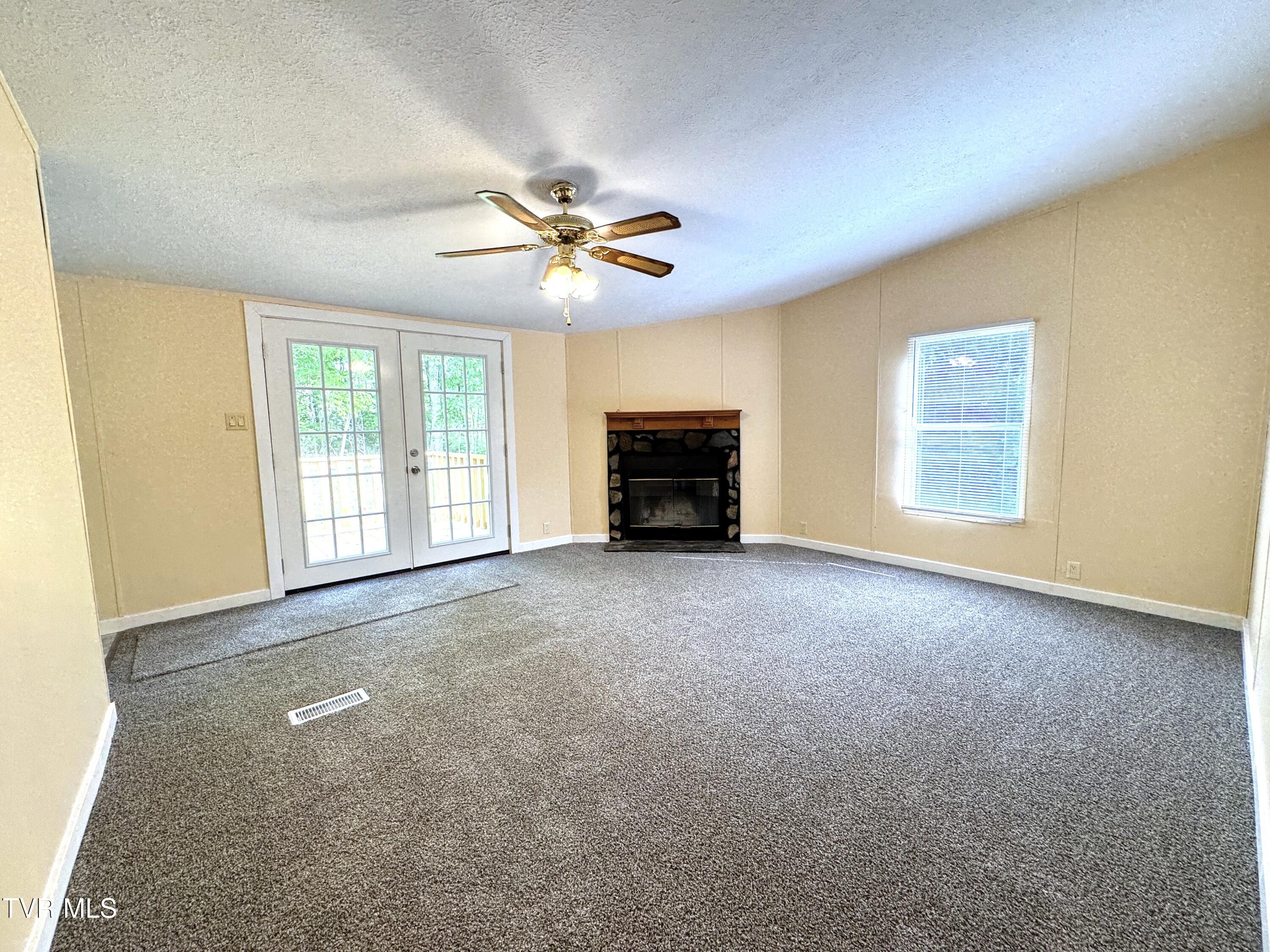 1555 Hamner Hollow Road Big Stone Gap, VA 24219 - Photo 25 of 41 FAMILY ROOM TOWARD FIREPLACE