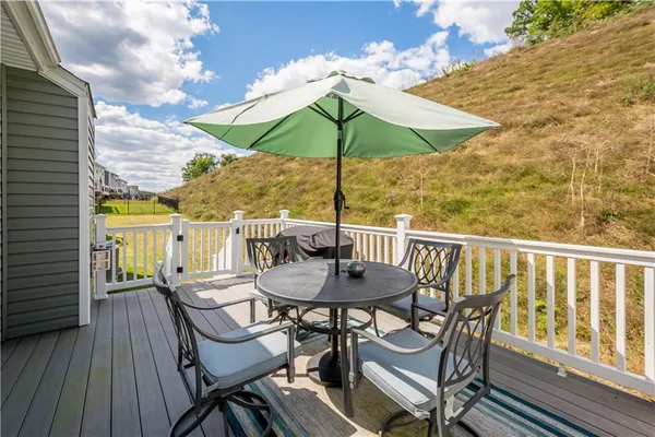 a view of balcony with outdoor seating and wooden floor