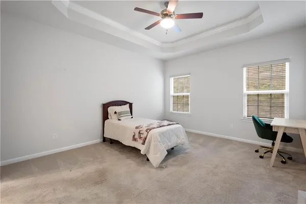 a bed room with a bed and a window