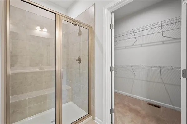 a bathroom with a glass shower door