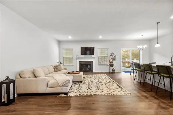 a living room with furniture fireplace and window
