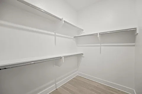 a view of an empty walk in closet