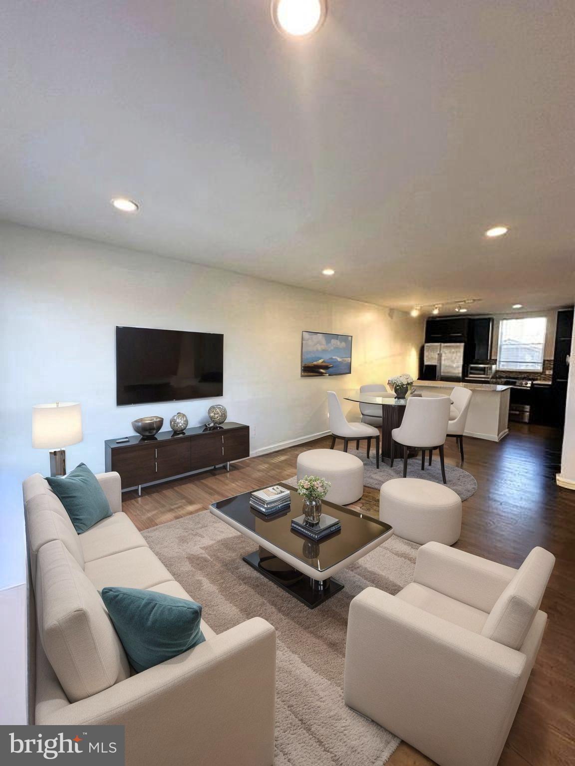 137 West Reed Avenue Alexandria, VA 22305 - Photo 1 of 16 a living room with furniture and a flat screen tv