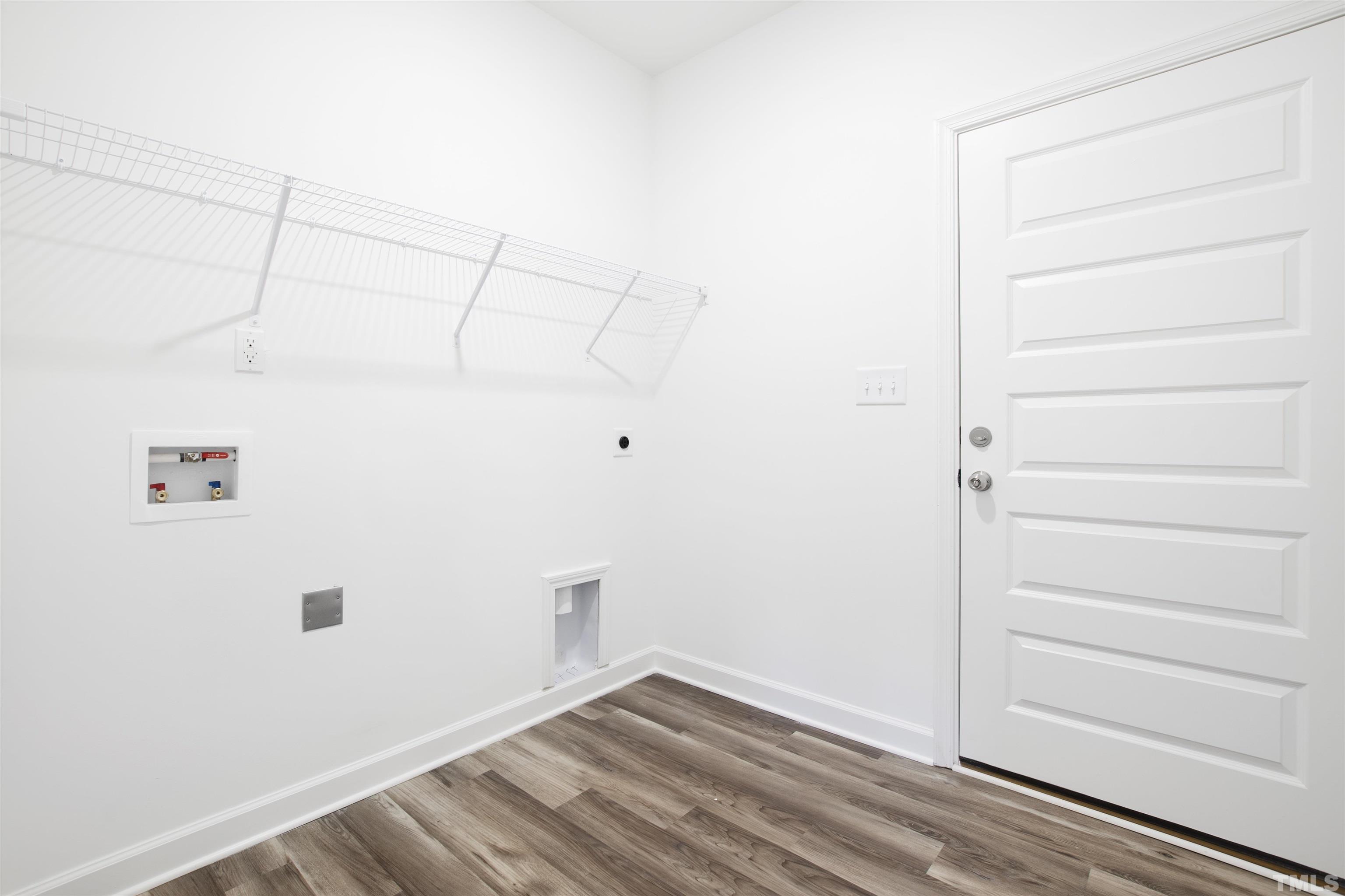 9677 Chapman Road Bailey, NC 27807 - Photo 17 of 31 a view of a room with racks on the wall