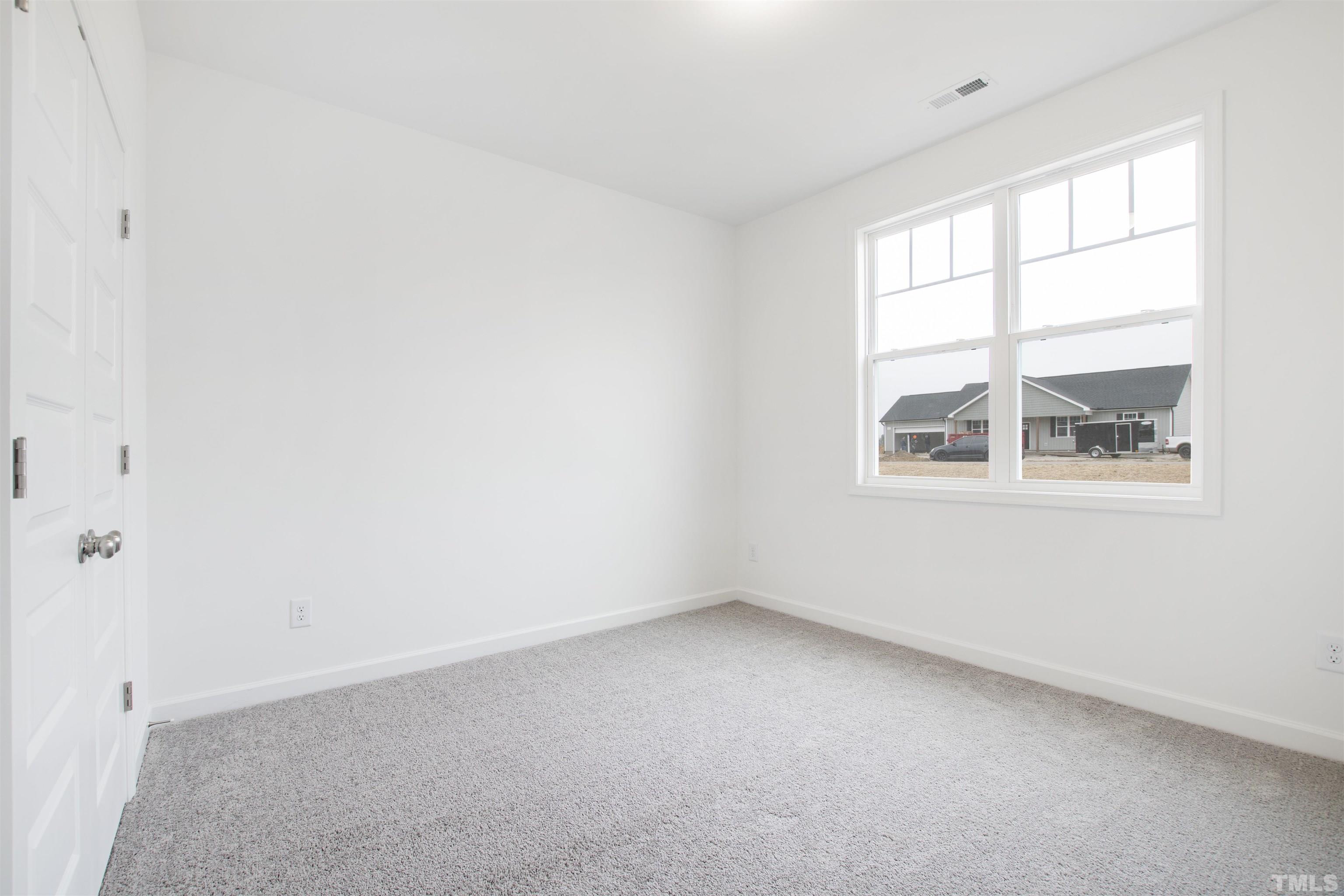 9677 Chapman Road Bailey, NC 27807 - Photo 23 of 31 an empty room with a window