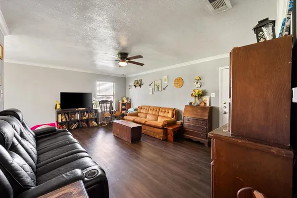 a living room with furniture or couch and a flat screen tv