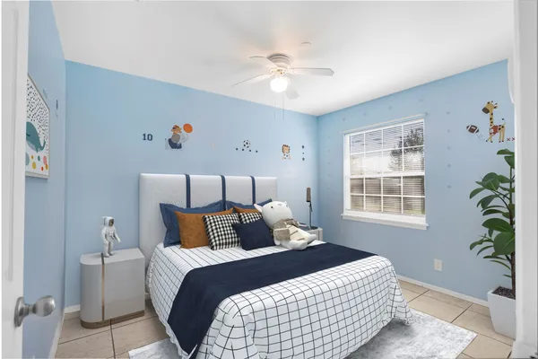a bedroom with a bed and window