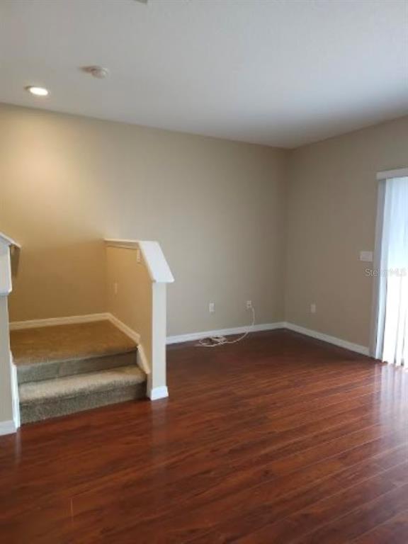 15662 Stable Run Drive Spring Hill, FL 34610 - Photo 12 of 29 a view of empty room with wooden floor