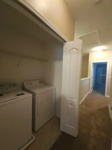 a view of an empty room and a window