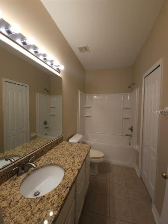 15662 Stable Run Drive Spring Hill, FL 34610 - Photo 20 of 29 a bathroom with a granite countertop sink and a mirror