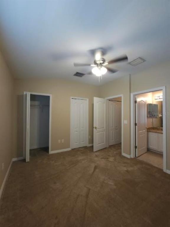 15662 Stable Run Drive Spring Hill, FL 34610 - Photo 23 of 29 a view of a room with a ceiling fan and bathroom