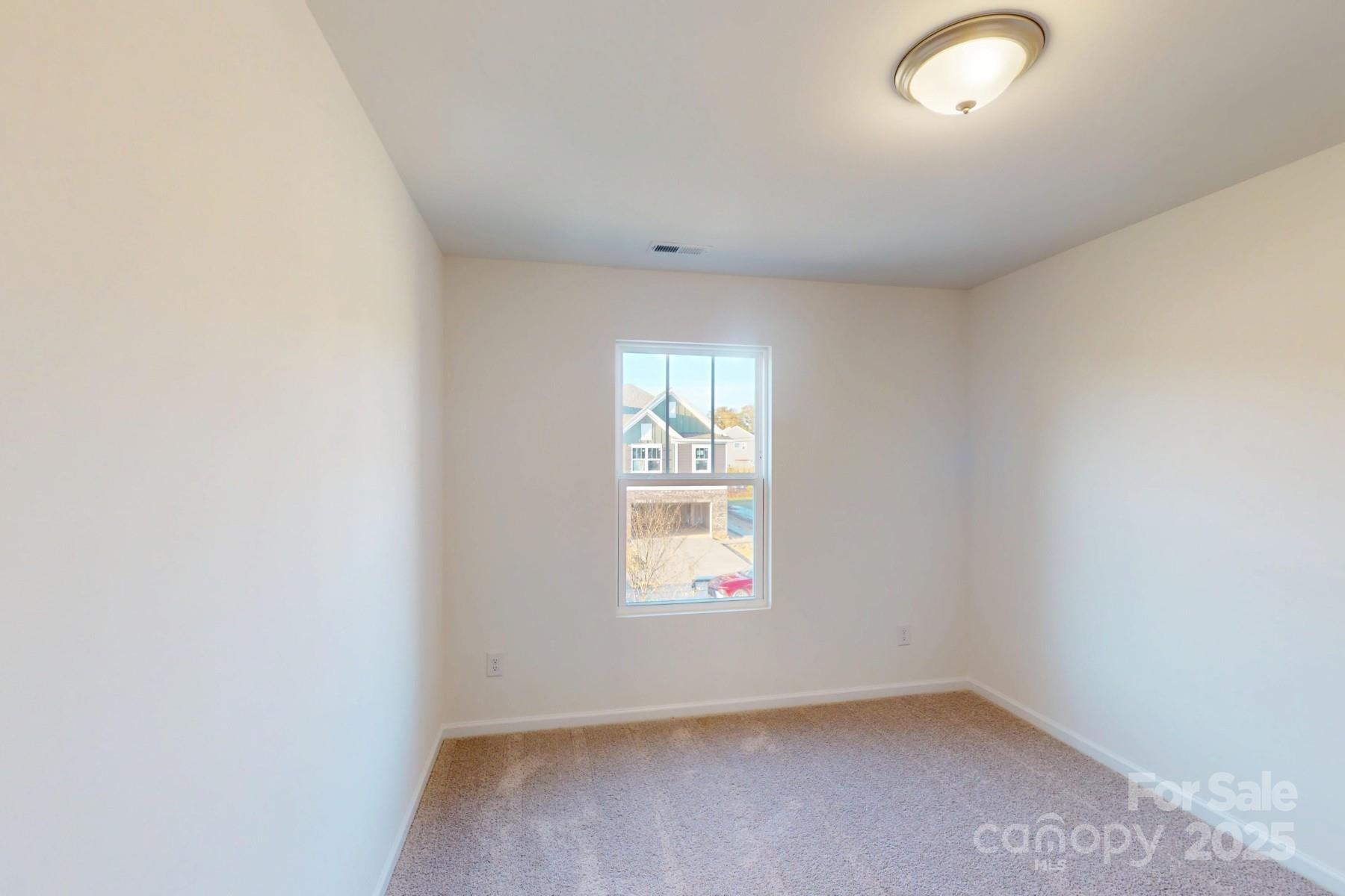 1137 Overbrook Place Wingate, NC 28174 - Photo 12 of 16 an empty room with a window