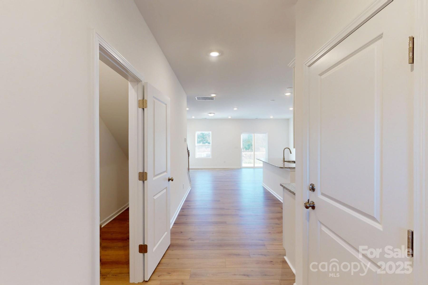 1137 Overbrook Place Wingate, NC 28174 - Photo 3 of 16 a view of a hallway with wooden floor