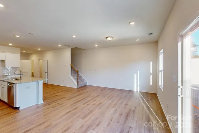 a view of kitchen with cabinets and wooden floor