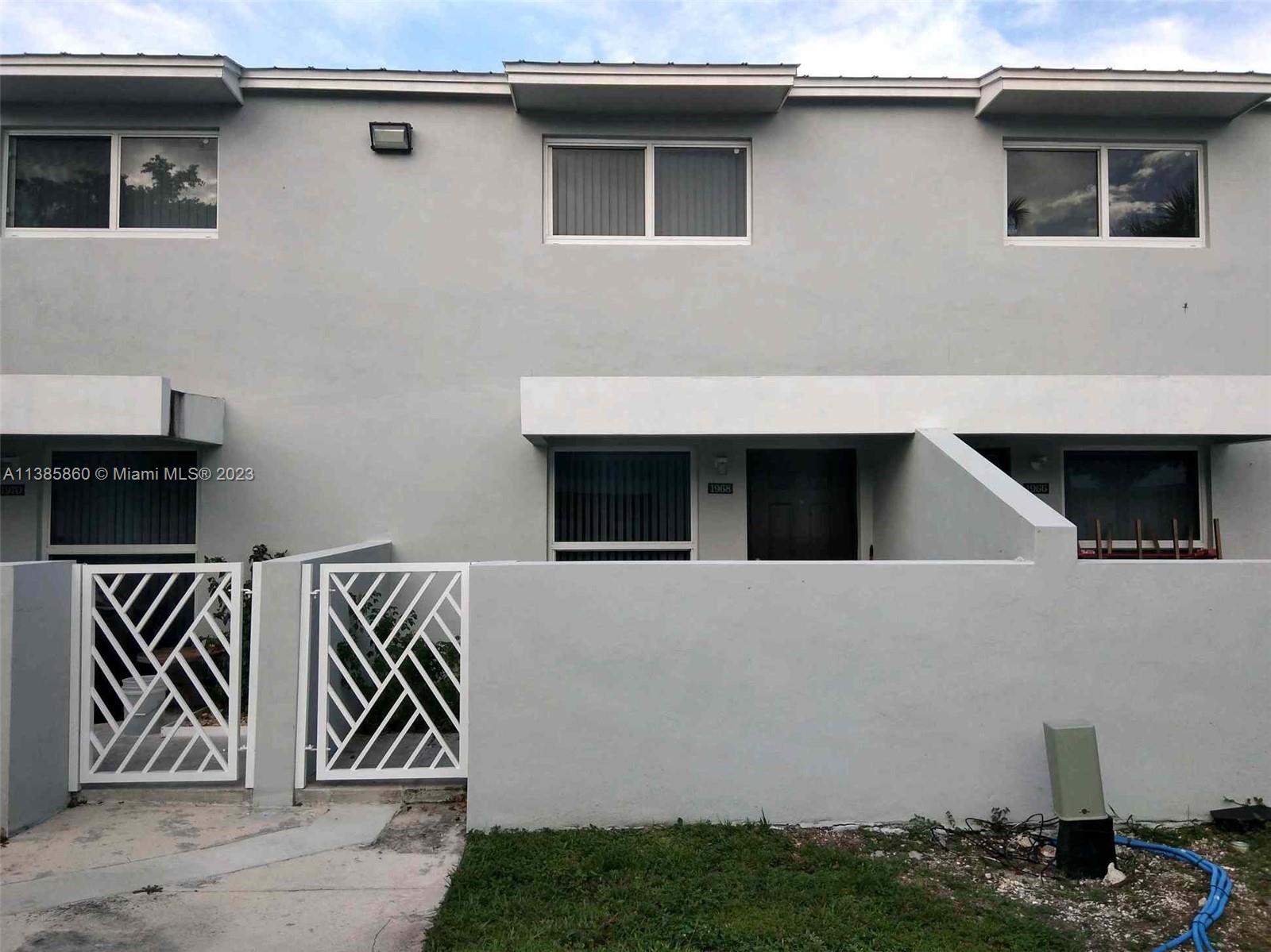 a front view of a house with garage