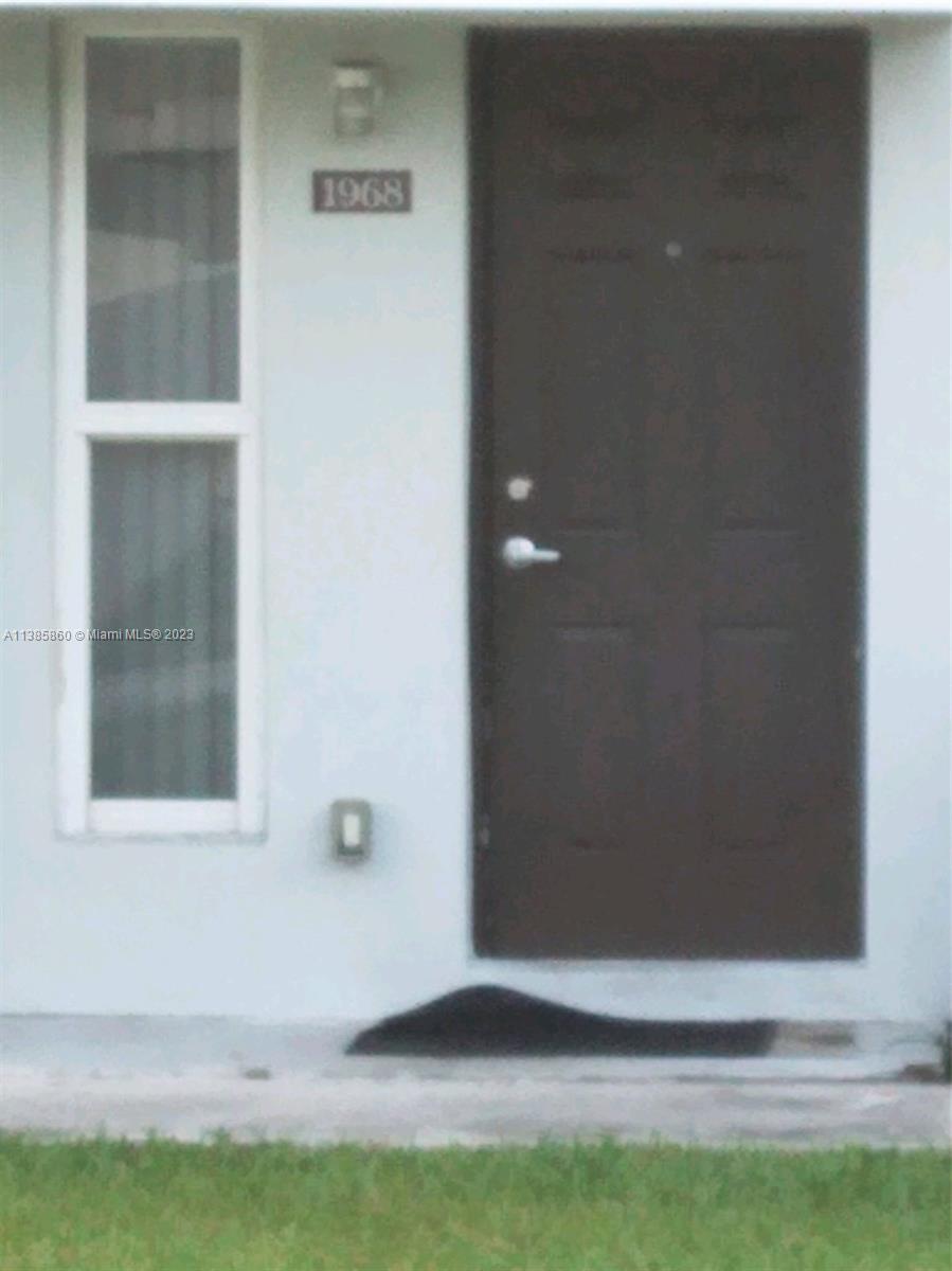 1968 Northwest 4th Court, Unit 323 Miami, FL 33136 - Photo 12 of 12 a view of wooden door