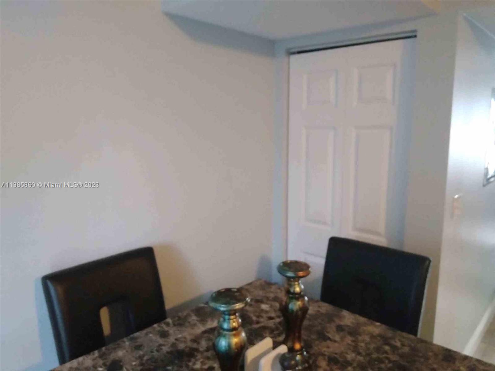 1968 Northwest 4th Court, Unit 323 Miami, FL 33136 - Photo 8 of 12 a living room with furniture and a gate