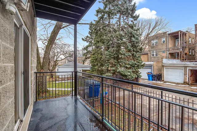 a view of a balcony with a tree