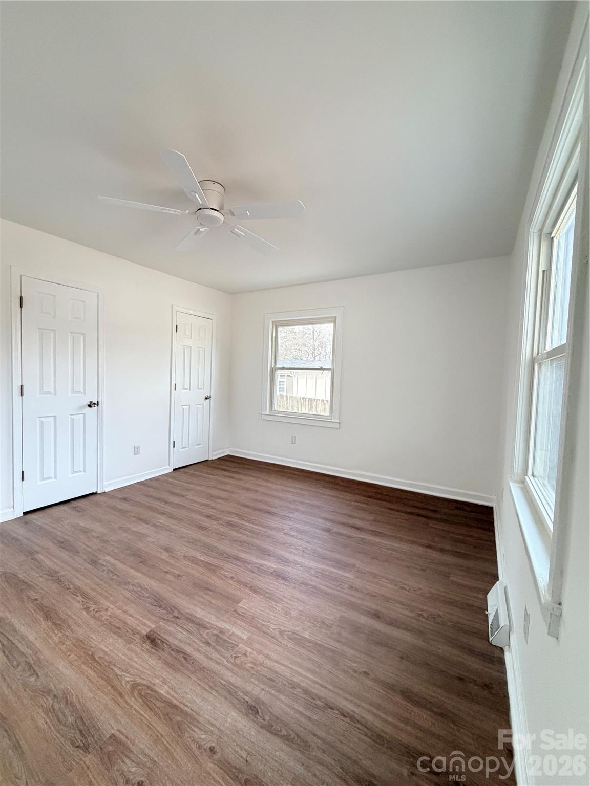 1114 Mt Olivet Road Kannapolis, NC 28083 - Photo 12 of 26 an empty room with wooden floor and window