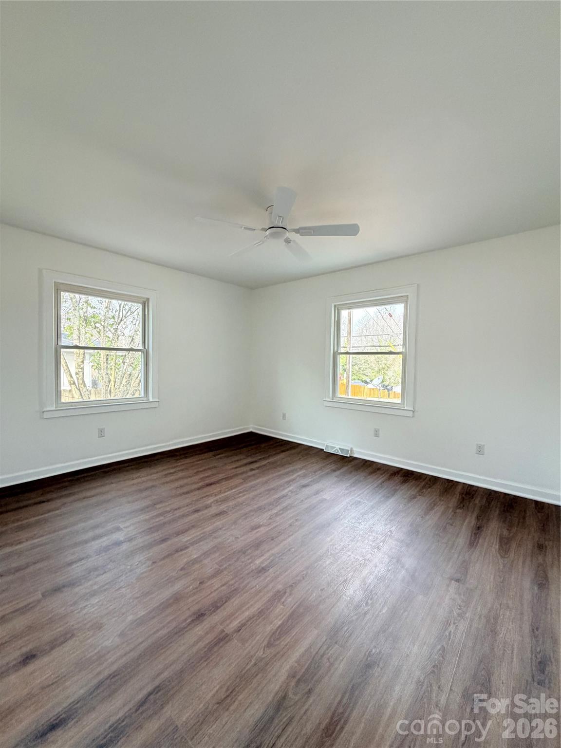 1114 Mt Olivet Road Kannapolis, NC 28083 - Photo 15 of 26 an empty room with wooden floor and windows