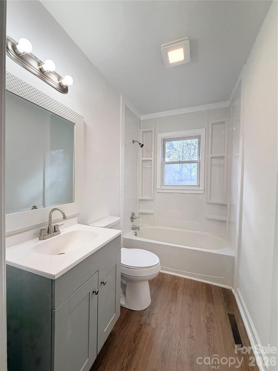 1114 Mt Olivet Road Kannapolis, NC 28083 - Photo 17 of 26 a bathroom with a double vanity sink and a mirror