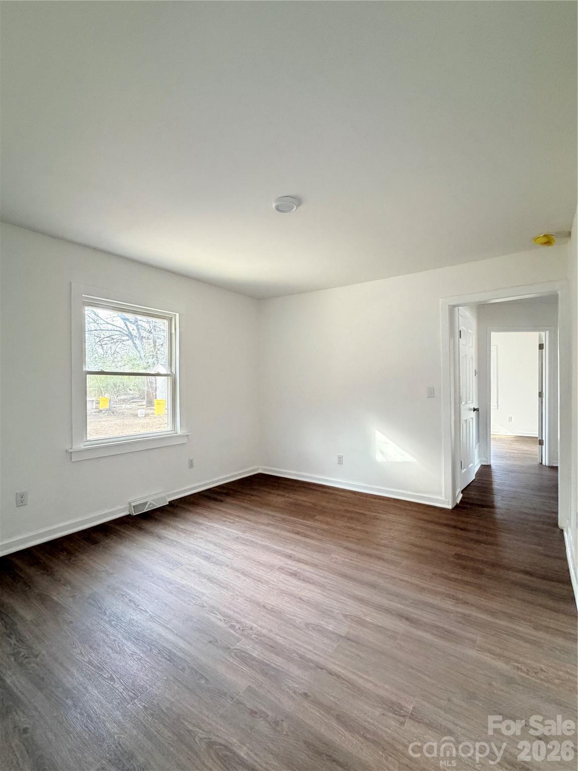 1114 Mt Olivet Road Kannapolis, NC 28083 - Photo 19 of 26 a view of an empty room with wooden floor and a window