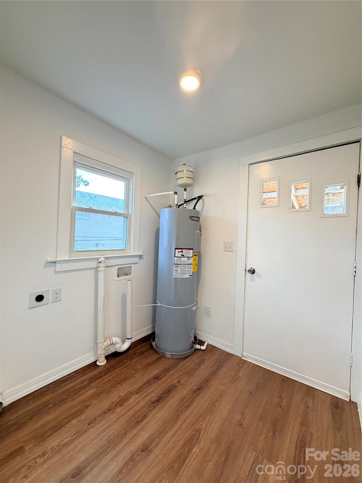 1114 Mt Olivet Road Kannapolis, NC 28083 - Photo 22 of 26 a view of empty room with wooden floor and windows