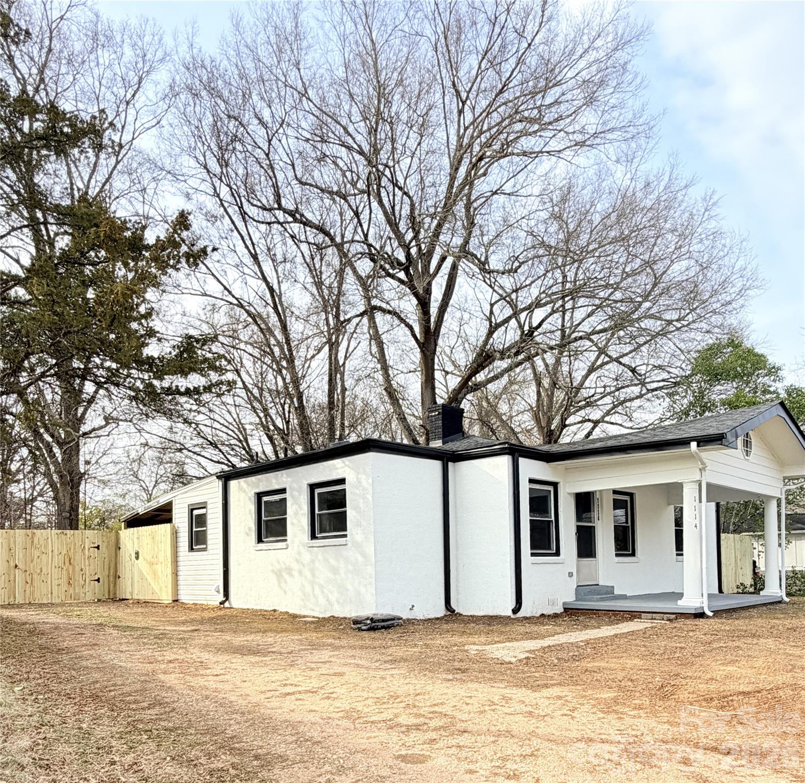 1114 Mt Olivet Road Kannapolis, NC 28083 - Photo 3 of 26 a house that has a tree in front of it