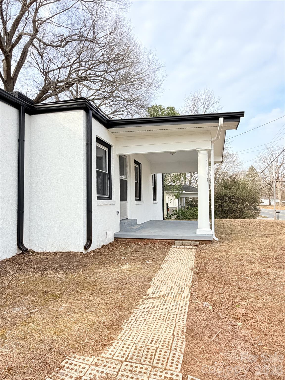 1114 Mt Olivet Road Kannapolis, NC 28083 - Photo 4 of 26 a front view of a house with garden