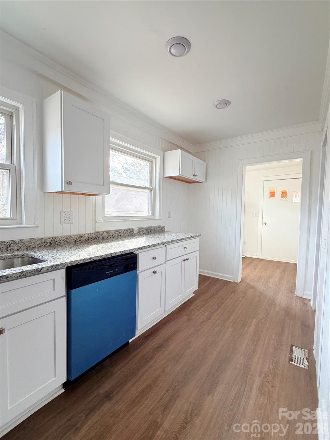 1114 Mt Olivet Road Kannapolis, NC 28083 - Photo 10 of 26 a kitchen with granite countertop a sink cabinets and wooden floor