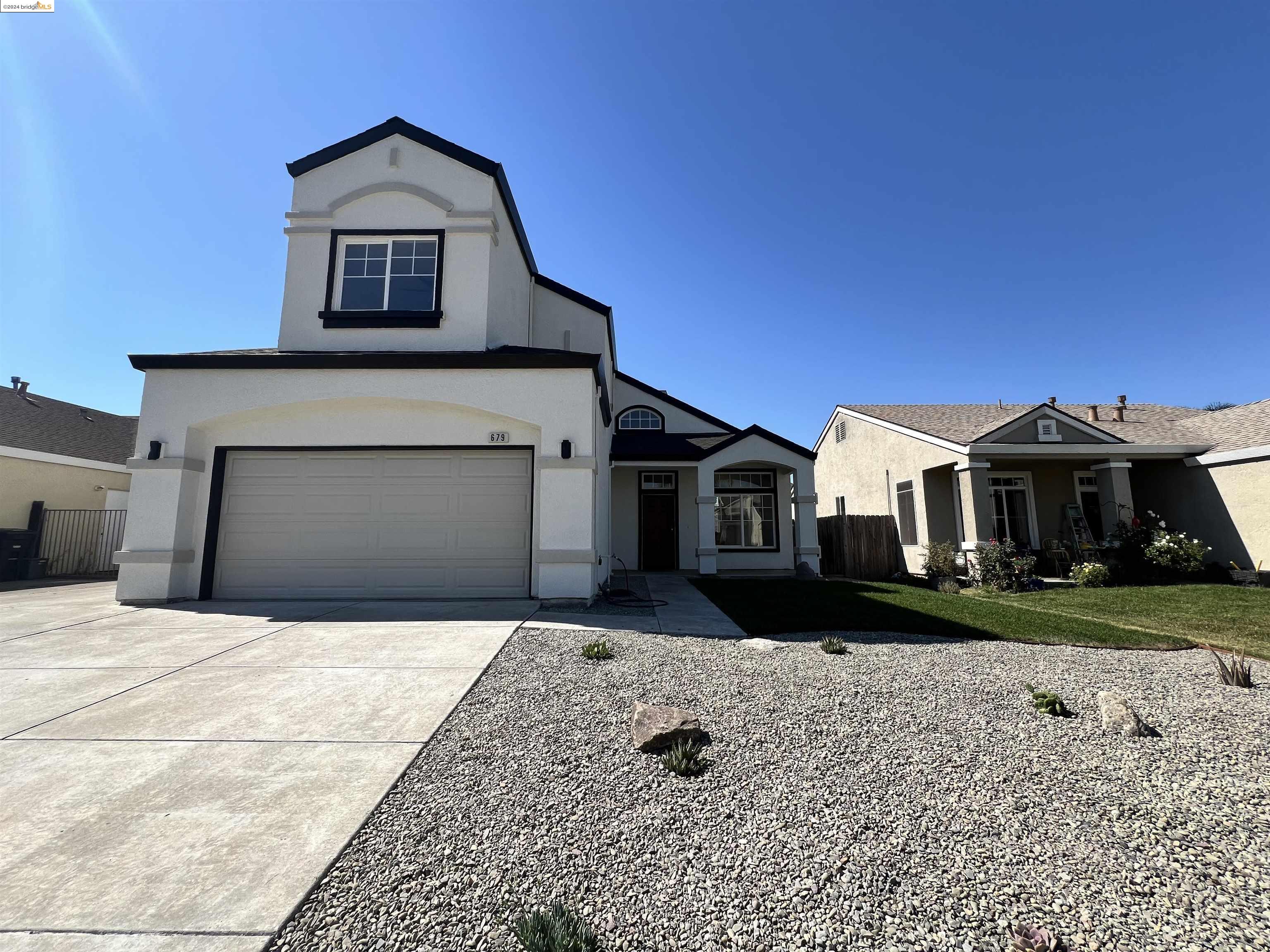 679 Christensen Way Rio Vista, CA 94571 - Photo 1 of 1 a front view of a house with a yard and garage