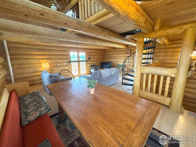 a view of a couches and dinning table in patio