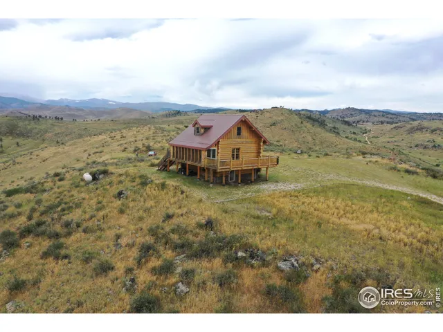 a view of a town with mountains in the background