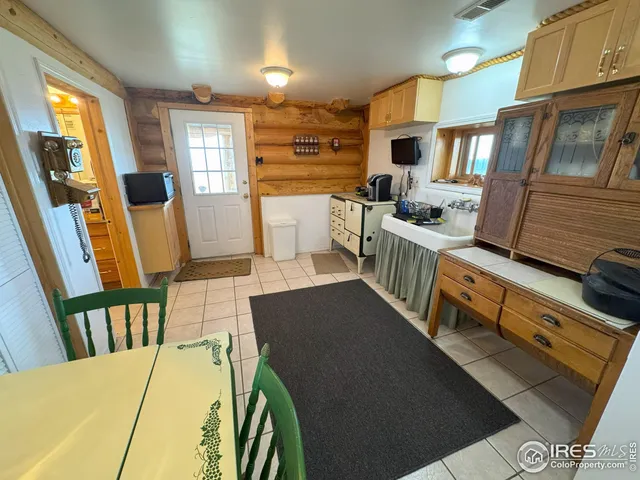 a bedroom with furniture and a flat screen tv